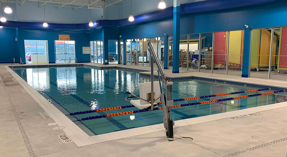 Indoor teaching pool with accessibility lift at Goldfish Swim School in Burlington, Ontario